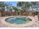 Relax in the community hot tub, surrounded by lush landscaping at 2670 Sequoia Ter # 1406, Palm Harbor, FL 34683