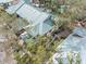 Aerial view of a home's metal roof and surrounding landscape at 2670 Sequoia Ter # 1406, Palm Harbor, FL 34683