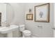 Clean and modern powder room with pedestal sink at 2721 Tarragona Way, Wesley Chapel, FL 33543