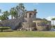 Elegant community entrance with stonework and water feature at 2721 Tarragona Way, Wesley Chapel, FL 33543