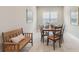 Bright dining room featuring a wood table, chairs, and bench at 2721 Tarragona Way, Wesley Chapel, FL 33543