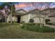 One-story house with a two-car garage and landscaped yard at 2721 Tarragona Way, Wesley Chapel, FL 33543