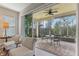 Enjoy the view from this screened patio with seating area at 2721 Tarragona Way, Wesley Chapel, FL 33543