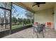 Enjoy the view from this screened patio with seating area at 2721 Tarragona Way, Wesley Chapel, FL 33543