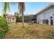 Large backyard with shed, fire pit, and screened pool enclosure at 3006 Mockingbird Ct, Clearwater, FL 33762