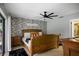 Relaxing bedroom with wood bed frame and patterned wallpaper at 3006 Mockingbird Ct, Clearwater, FL 33762