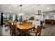 Bright dining room with a wood table and chairs, open to the kitchen at 3006 Mockingbird Ct, Clearwater, FL 33762