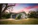 House exterior showcasing architectural details and curb appeal at sunset at 3006 Mockingbird Ct, Clearwater, FL 33762