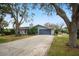 Charming single-story home with attached garage and mature landscaping at 3006 Mockingbird Ct, Clearwater, FL 33762