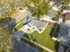 House with a green lawn, seen from an aerial view, in a residential area at 3102 Jarvis St, Holiday, FL 34690