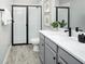 Modern bathroom with a shower and gray vanity at 31394 Pendleton Landing Cir, Wesley Chapel, FL 33545