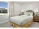 Cozy bedroom with window and a full bed at 31394 Pendleton Landing Cir, Wesley Chapel, FL 33545