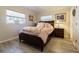 Cozy bedroom featuring a double bed, wood floors, and ample natural light at 3230 San Bernadino St, Clearwater, FL 33759