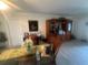 Dining area with glass-top table, chairs, and a hutch at 3230 San Bernadino St, Clearwater, FL 33759