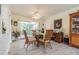 Elegant dining room featuring a glass-top table and wicker chairs at 3230 San Bernadino St, Clearwater, FL 33759