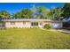 Pink house with white trim and a grassy yard at 3230 San Bernadino St, Clearwater, FL 33759