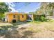 Single story home with a screened porch and backyard at 3230 San Bernadino St, Clearwater, FL 33759