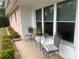 Small patio area with a table and chairs near the home's entrance at 3230 San Bernadino St, Clearwater, FL 33759