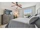 Well-lit bedroom with a king-size bed and dresser at 3795 Morgons Castle Ct, Land O Lakes, FL 34638