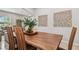 Elegant dining room featuring a live-edge wood table and modern chairs at 3795 Morgons Castle Ct, Land O Lakes, FL 34638