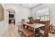 Dining room with a long live-edge wood table and bench seating at 3795 Morgons Castle Ct, Land O Lakes, FL 34638