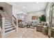 Modern living room featuring neutral colored sofas and a large window at 3795 Morgons Castle Ct, Land O Lakes, FL 34638