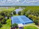 Two tennis courts with surrounding landscape at 3795 Morgons Castle Ct, Land O Lakes, FL 34638