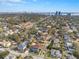 Aerial view of the property showcases its location in a lush residential neighborhood near the city skyline at 3815 W San Juan St, Tampa, FL 33629