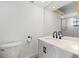 Clean bathroom with white vanity, black accents, and a shower at 3815 W San Juan St, Tampa, FL 33629