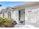 Modern front door with black accents, and welcoming entryway with landscaping at 3815 W San Juan St, Tampa, FL 33629