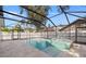 Relaxing screened pool and spa with light beige tile deck at 3815 W San Juan St, Tampa, FL 33629