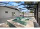 Modern screened pool and spa with tranquil water features at 3815 W San Juan St, Tampa, FL 33629