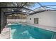 Inviting screened pool and spa with a spacious deck at 3815 W San Juan St, Tampa, FL 33629