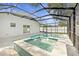 Modern spa with adjacent pool and covered patio at 3815 W San Juan St, Tampa, FL 33629