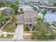 Two-story house with driveway, landscaping, and canal views at 402 Islebay Dr, Apollo Beach, FL 33572