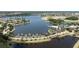 Aerial view of Mira Bay, showcasing the lake, clubhouse, and landscaping at 402 Islebay Dr, Apollo Beach, FL 33572