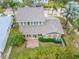 Aerial view of the house, showcasing backyard and landscaping at 402 Islebay Dr, Apollo Beach, FL 33572