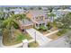 Attractive two-story house with a large yard and palm trees at 402 Islebay Dr, Apollo Beach, FL 33572