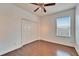 Bedroom with double door closet and hardwood floors at 402 Islebay Dr, Apollo Beach, FL 33572