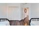 Bedroom with hardwood floors and a view of the hallway at 402 Islebay Dr, Apollo Beach, FL 33572