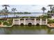 Aerial view of a stone bridge over a canal in a community at 402 Islebay Dr, Apollo Beach, FL 33572