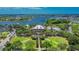 Aerial view of a community clubhouse with lush landscaping at 402 Islebay Dr, Apollo Beach, FL 33572