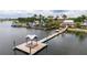 Aerial view of a community dock with a gazebo and kayaks at 402 Islebay Dr, Apollo Beach, FL 33572