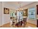 Bright dining room with hardwood floors and a chandelier at 402 Islebay Dr, Apollo Beach, FL 33572