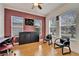 Home office with hardwood floors, two black chairs, and a desk at 402 Islebay Dr, Apollo Beach, FL 33572