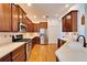 Modern kitchen with stainless steel appliances and wood cabinets at 402 Islebay Dr, Apollo Beach, FL 33572