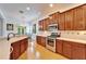 Eat-in kitchen, featuring stainless steel appliances and hardwood floors at 402 Islebay Dr, Apollo Beach, FL 33572