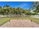 Brick paved patio with surrounding greenery and lighting at 402 Islebay Dr, Apollo Beach, FL 33572