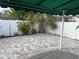 Private backyard oasis with paver patio and lush landscaping at 410 W Lemon St, Tarpon Springs, FL 34689