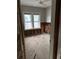 A bedroom undergoing renovation with exposed wooden beams and flooring at 410 W Lemon St, Tarpon Springs, FL 34689